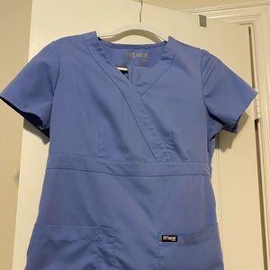 Light blue scrubs. Top and pants included